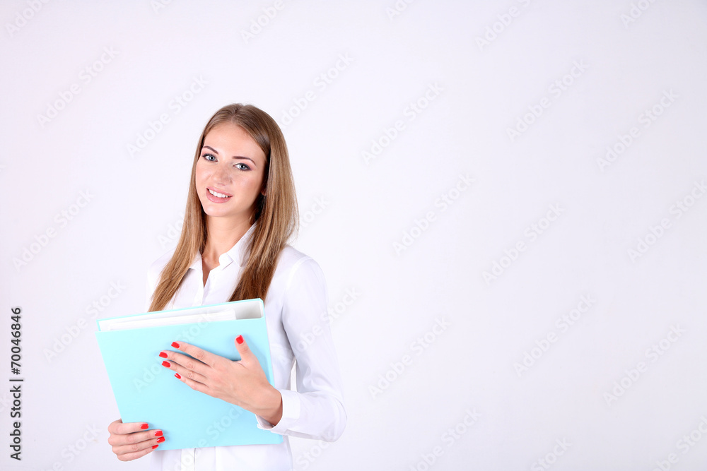 Business woman holding folder, isolated on white Business woman holding folder, isolated on white