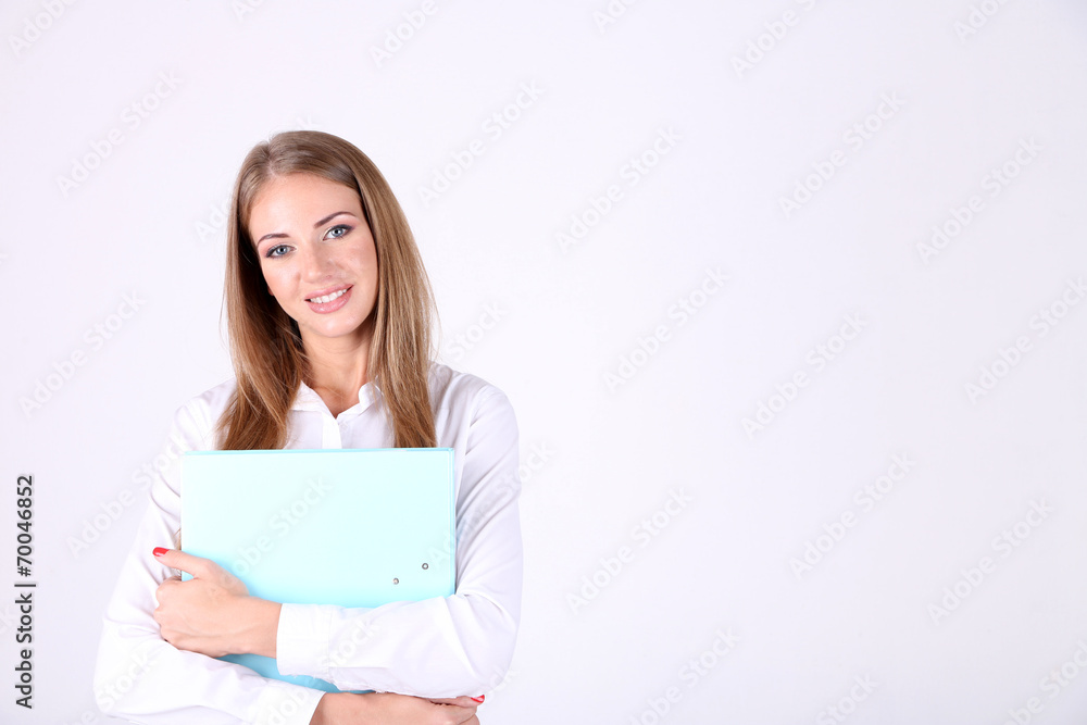 Business woman holding folder, isolated on white Business woman holding folder, isolated on white