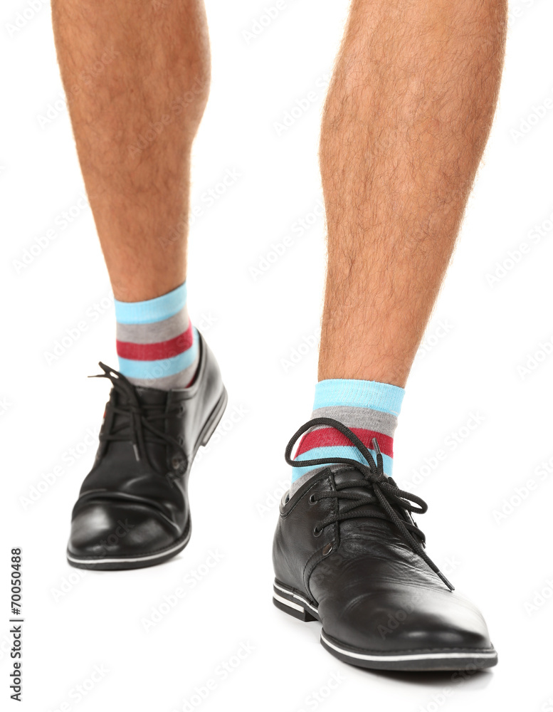 Man leg in suit and colorful socks, isolated on white