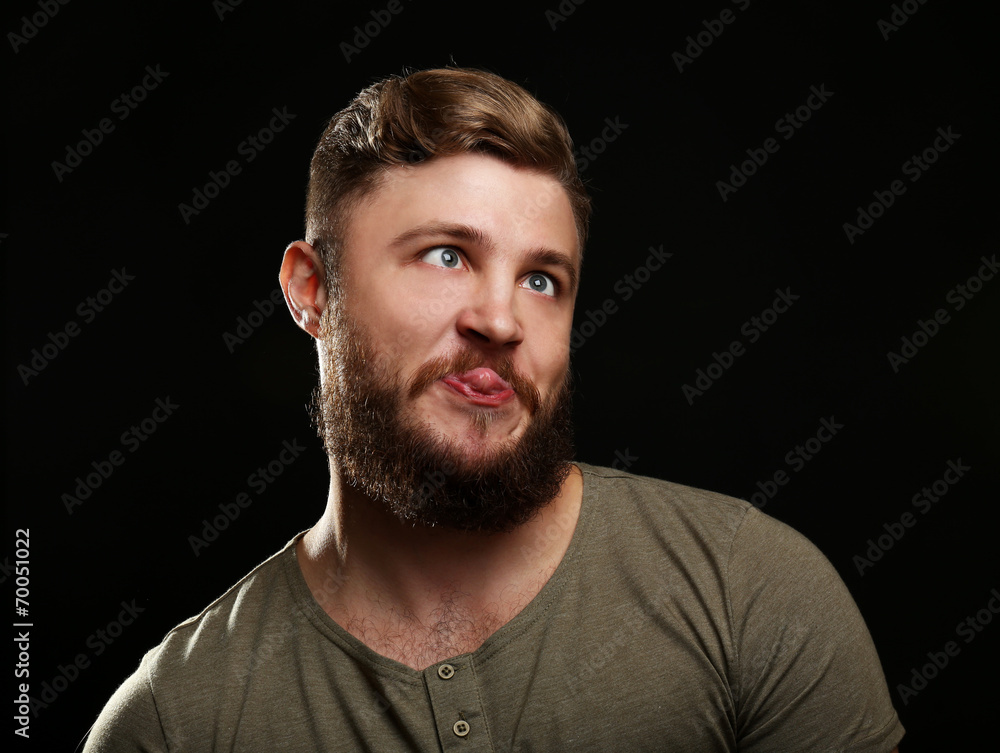 Portrait of handsome man with beard on black background Portrait of handsome man with beard on black background