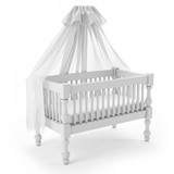 white baby crib with canopy