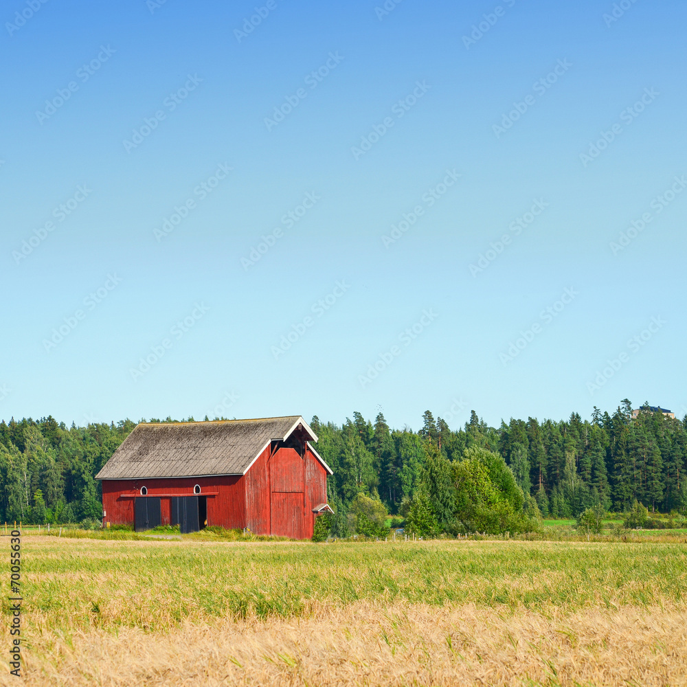 Beautiful nordic red house against the blue sky Beautiful nordic red house against the blue sky
