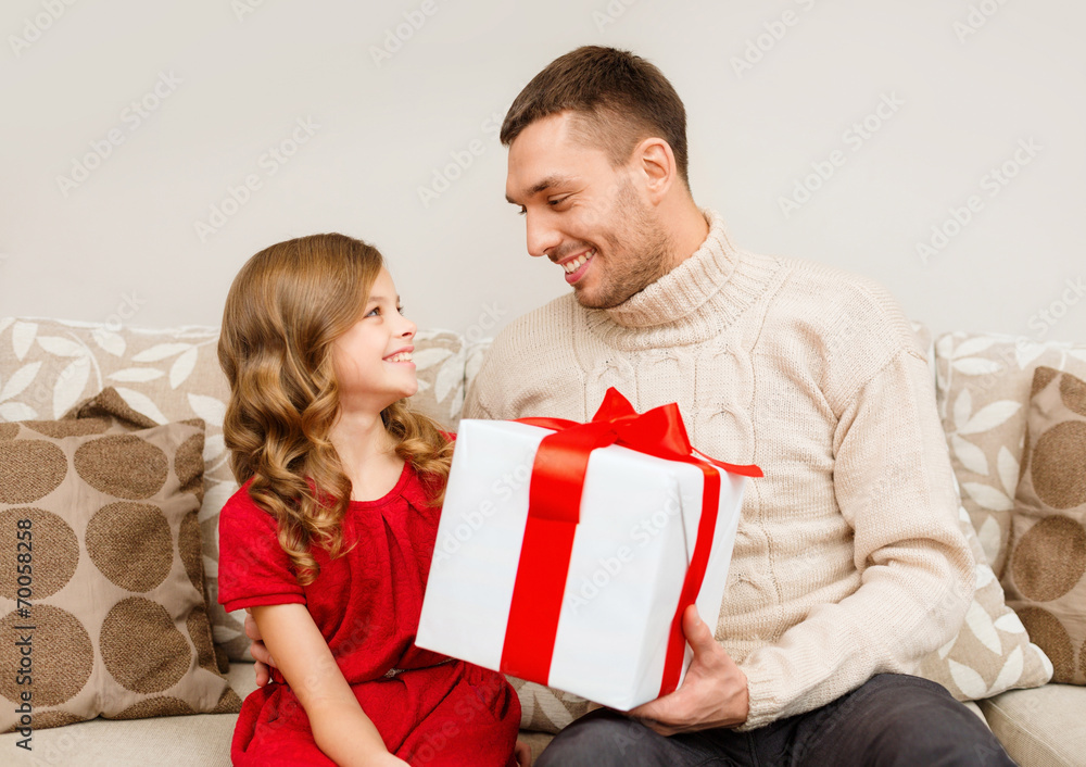 smiling father and daughter looking at each other smiling father and daughter looking at each other