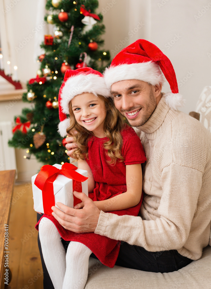 smiling father and daughter holding gift box smiling father and daughter holding gift box