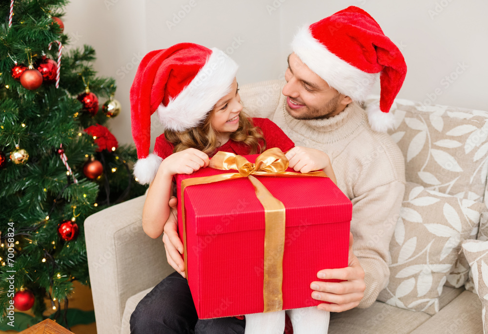 © Syda Productions - smiling father and daughter opening gift box