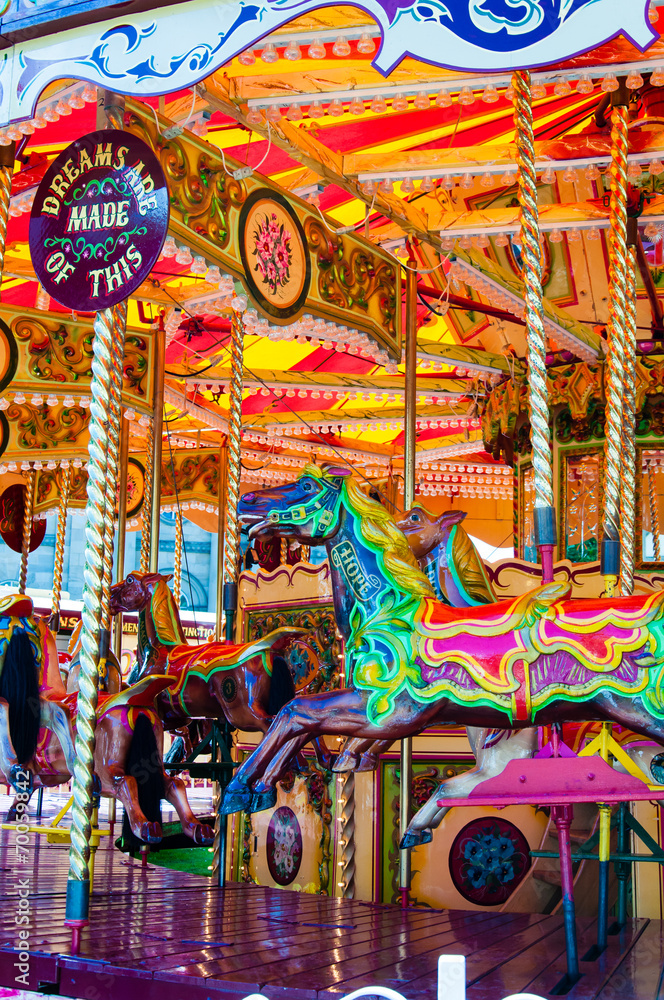 View of Carousel with horses on a carnival Merry Go Round