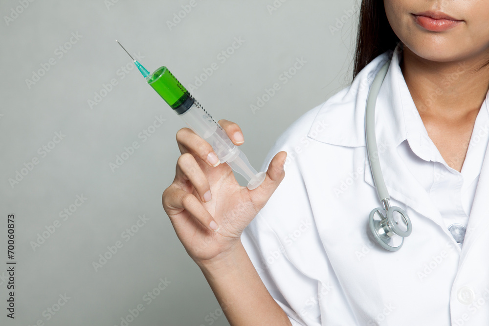 Close up young Asian female doctor with syringe Close up young Asian female doctor with syringe