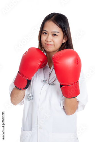 Young Asian female doctor guard with boxing glove