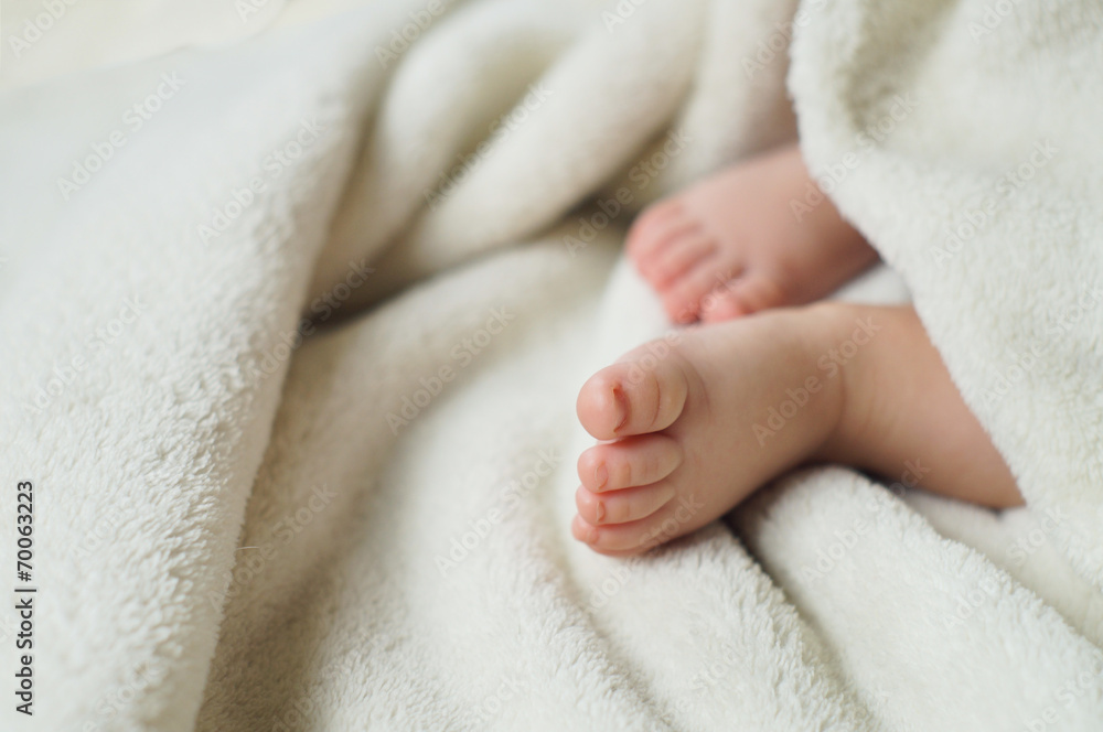 Baby Feet under blanket