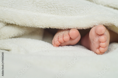 Baby Feet under blanket