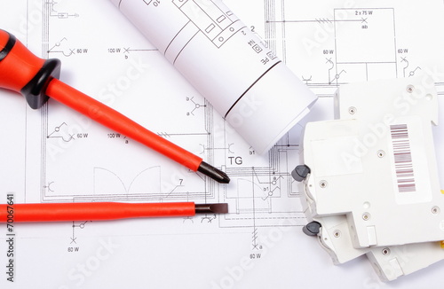 Diagrams, electric fuse and screwdrivers on construction drawing