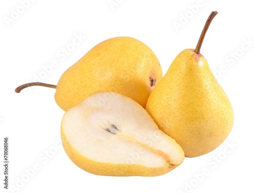 Whole and cut pears on a white
