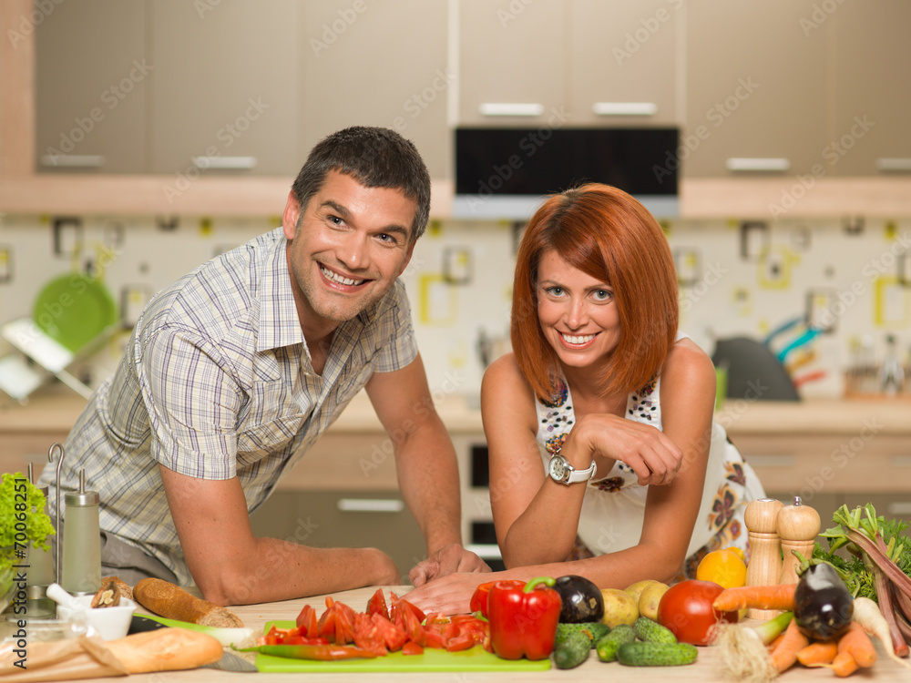 happy couple enjoying cooking