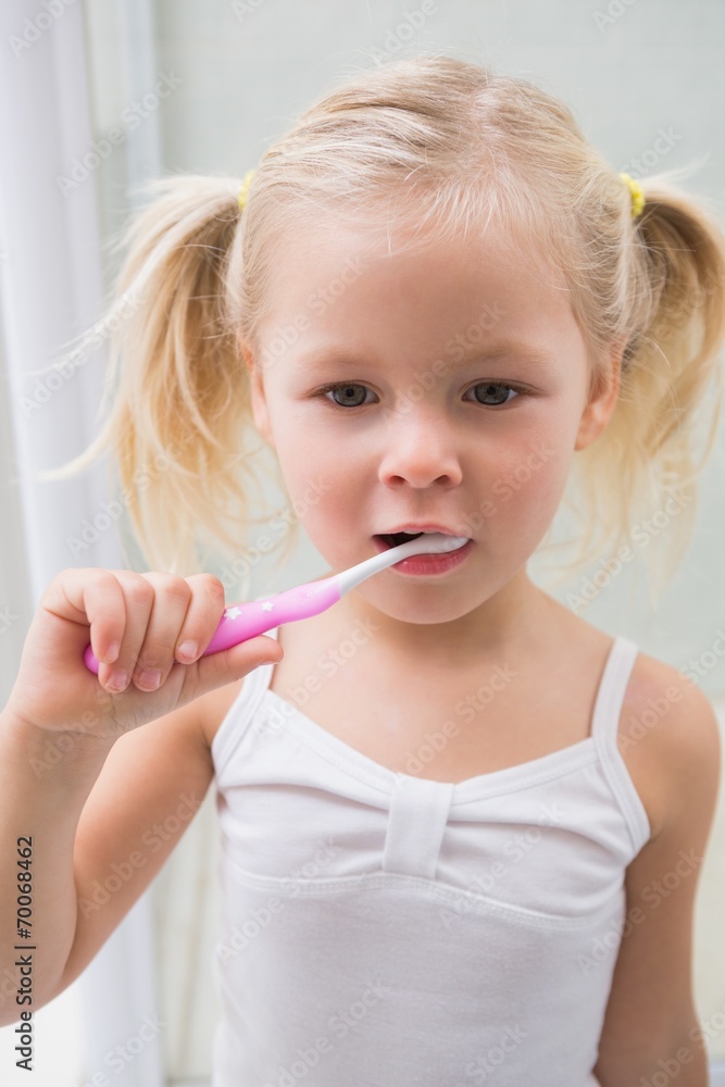 Cute girl brushing her teeth Cute girl brushing her teeth