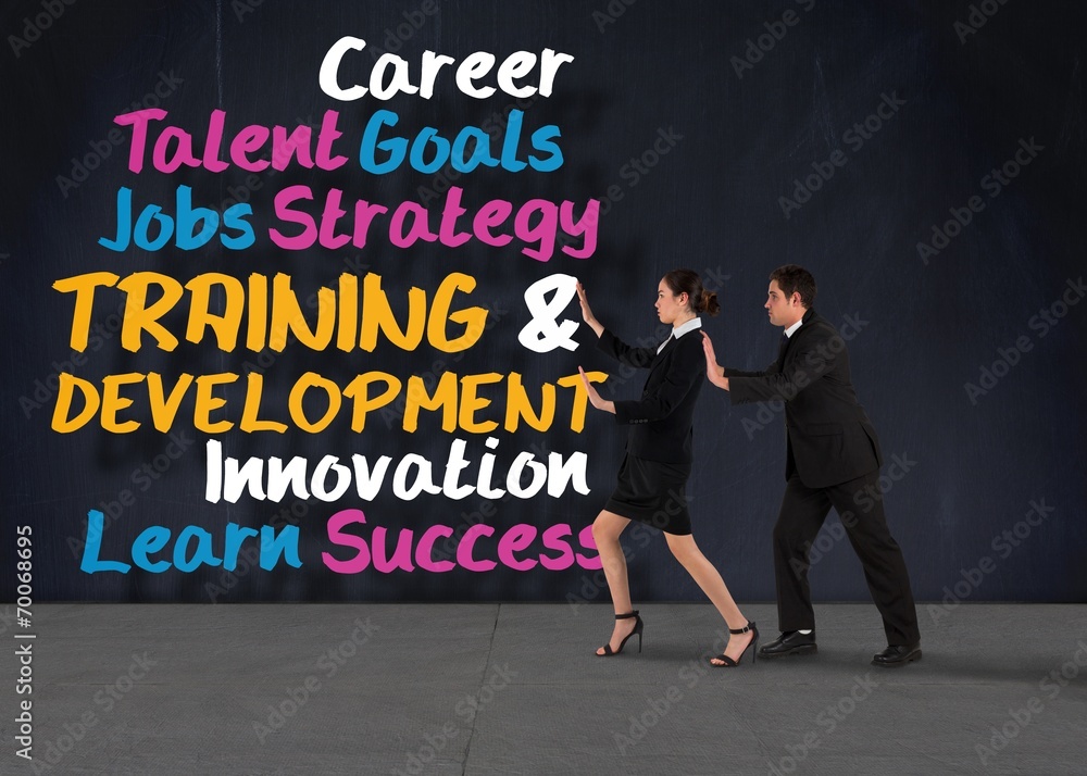 Composite image of business team standing and pushing Composite image of business team standing and pushing