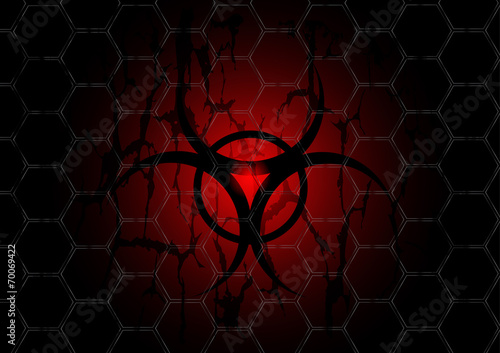biohazard dark red symbol behind mesh metal