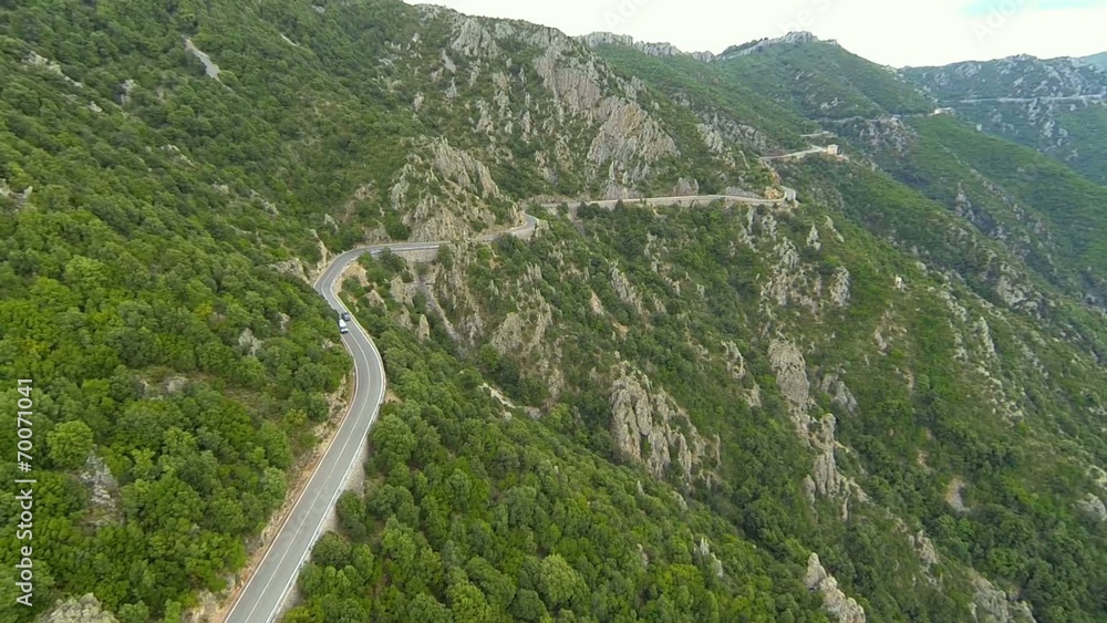 flying over winding mountain road in sardinia, italy flying over winding mountain road in sardinia, italy