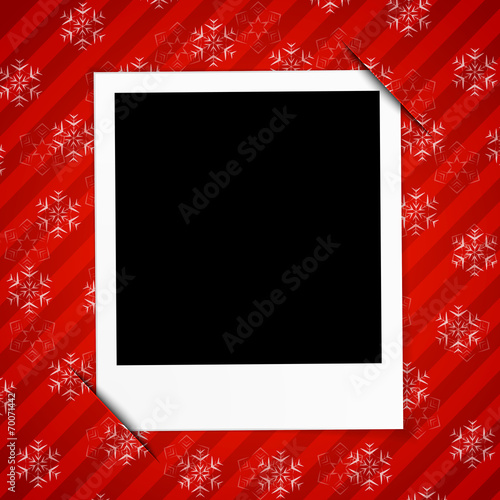 Winter holidays card with blank photo frame on red background
