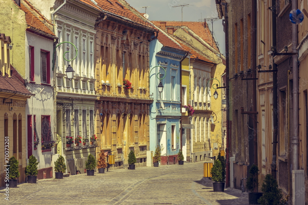 Medieval houses and promenade alley in Brasov, Romania