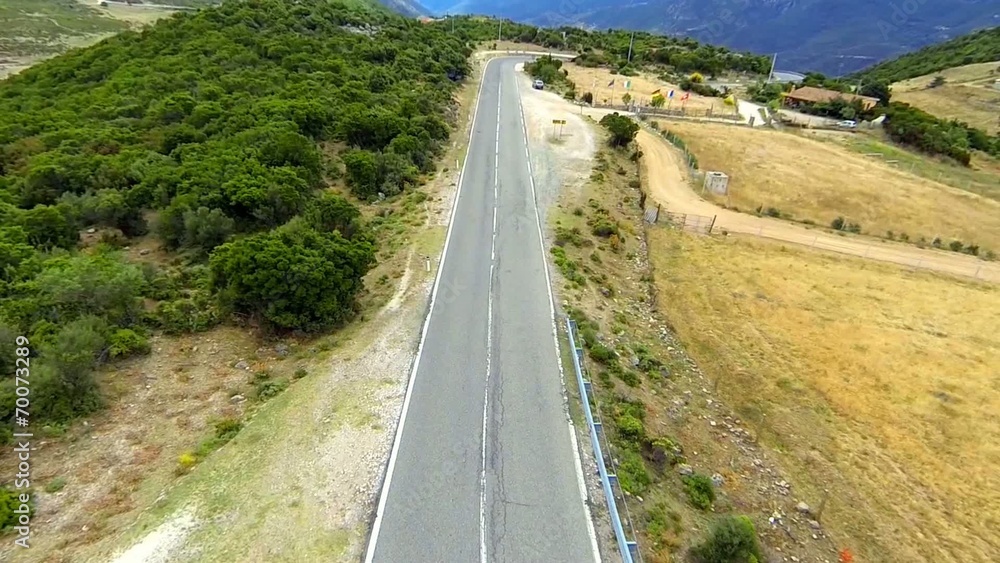 flying over winding mountain road in sardinia, italy flying over winding mountain road in sardinia, italy