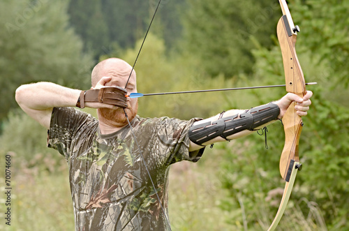 Young archer training with the bow 