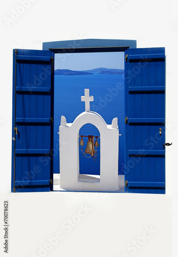 Open traditional Greek blue window on Santorini island, Greece