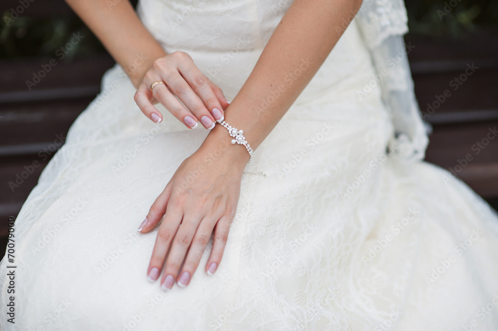 Wedding gloves on hands of bride, close-up Wedding gloves on hands of bride, close-up
