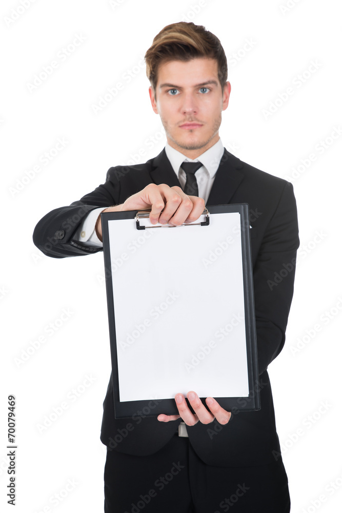 Confident Businessman Holding Clipboard With Blank Paper Confident Businessman Holding Clipboard With Blank Paper