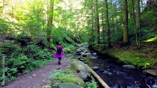 young woman hiking in the forest