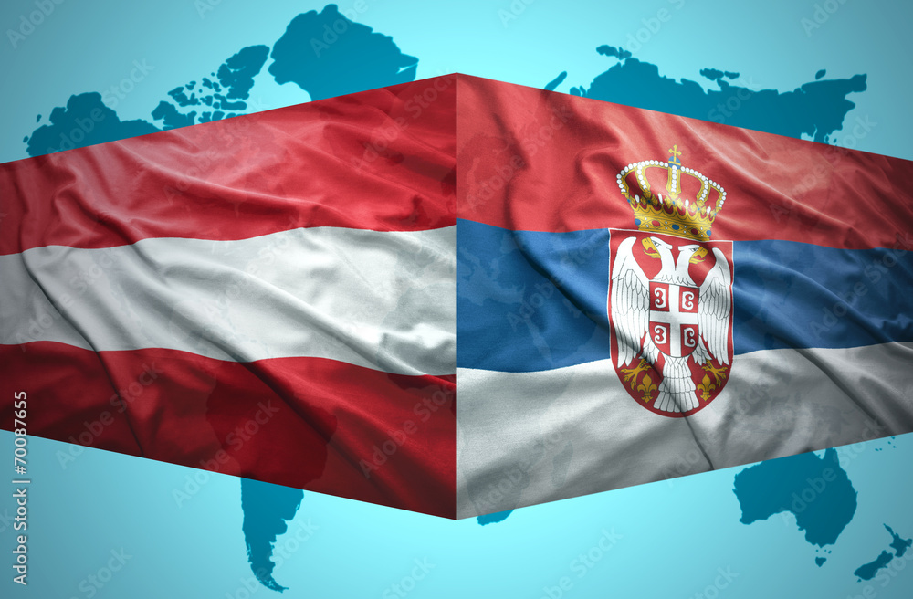 Fototapeta premium Waving Serbian and Austrian flags