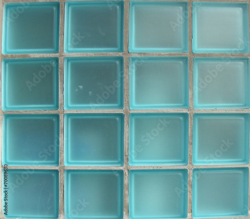 square glass tiles from window in bright blue