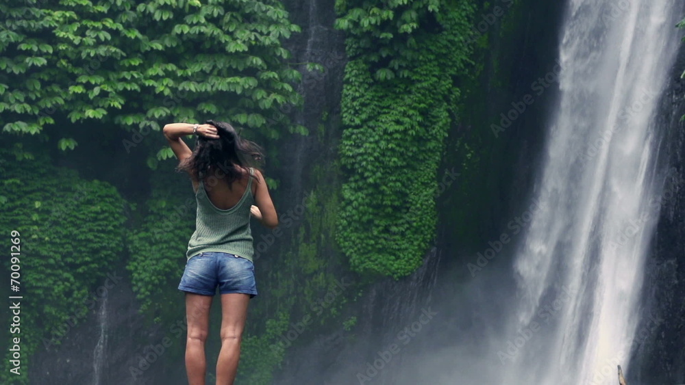 Woman dissolving hair and feeling free, slow motion shot Woman dissolving hair and feeling free, slow motion shot