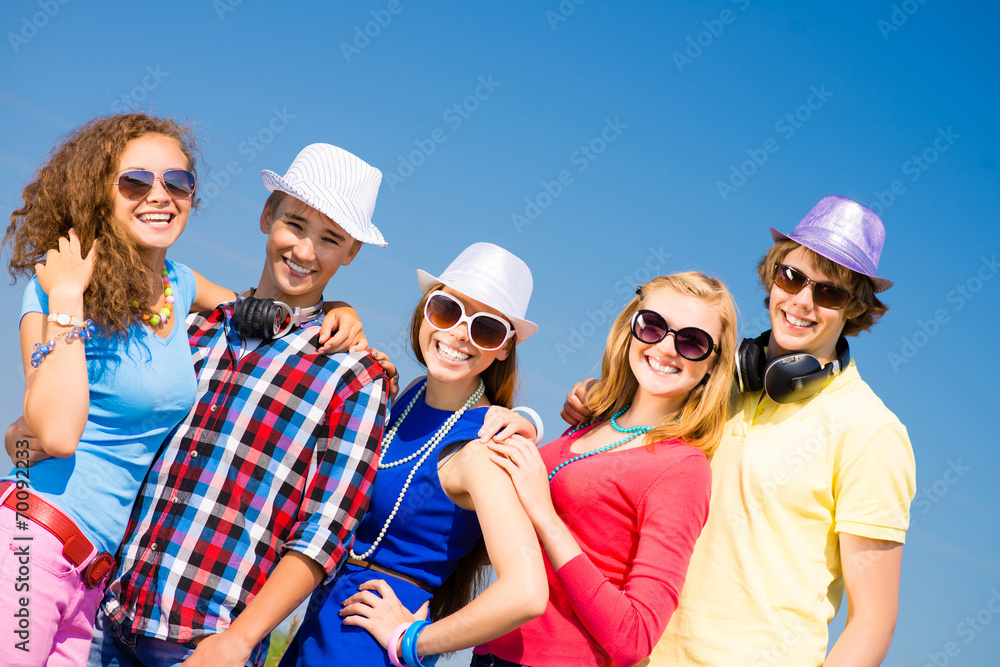 group of young people wearing sunglasses and hat group of young people wearing sunglasses and hat
