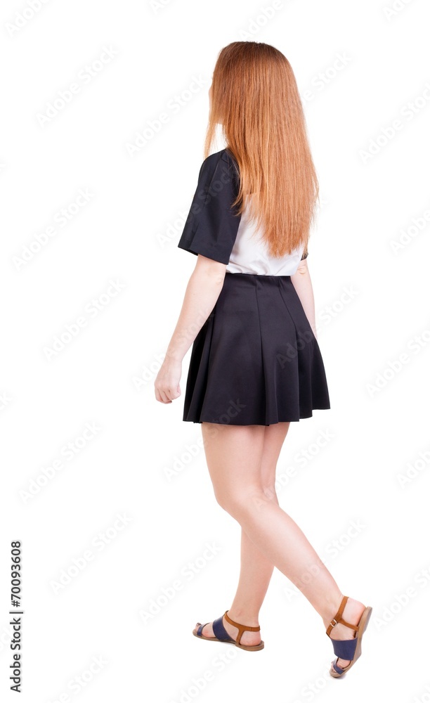 back view of walking woman. back view of walking woman.