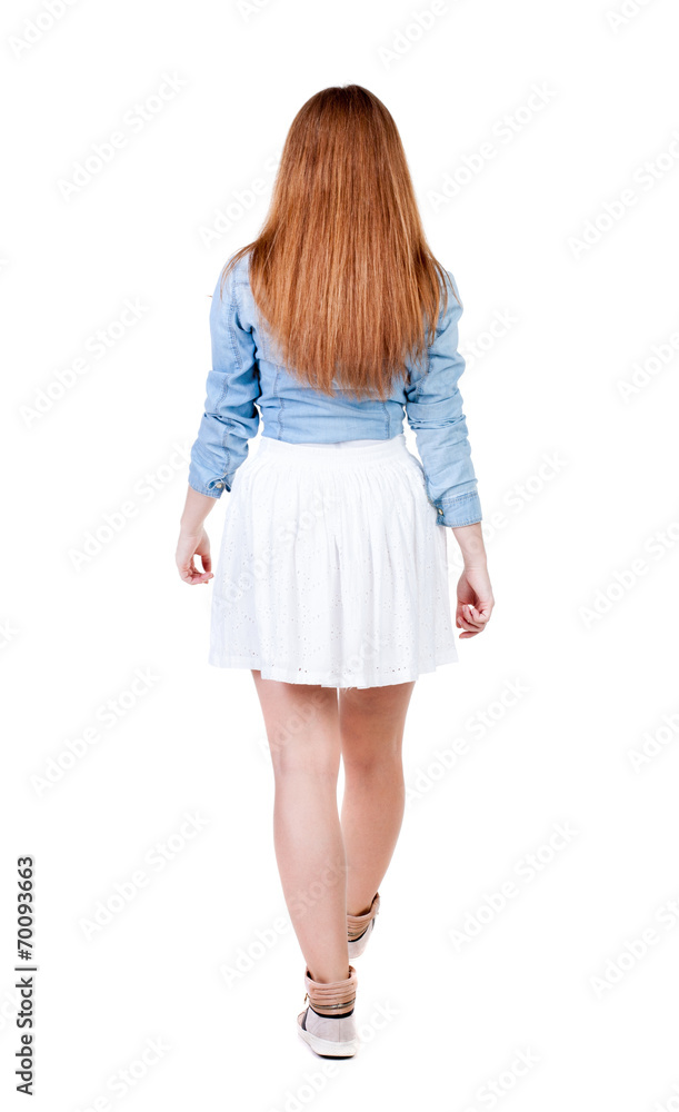 back view of walking woman. back view of walking woman.