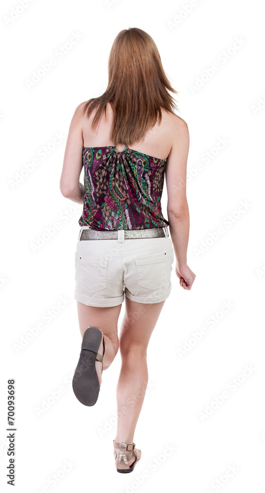back view of running woman in shorts back view of running woman in shorts