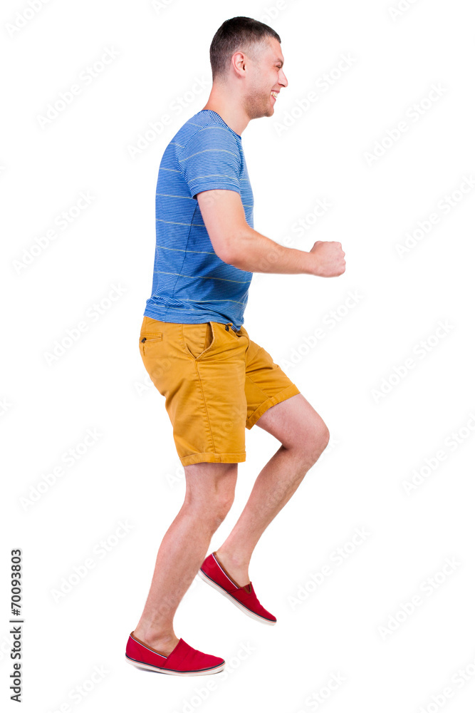 Back view of running man in t-shirt and shorts Back view of running man in t-shirt and shorts