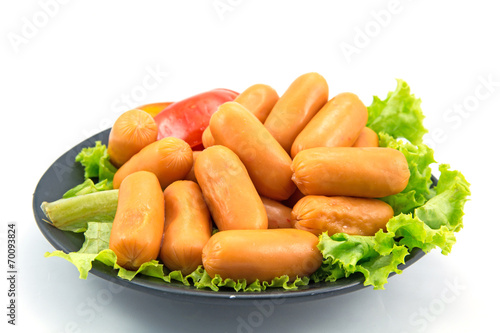 sausages and lettuce on white background