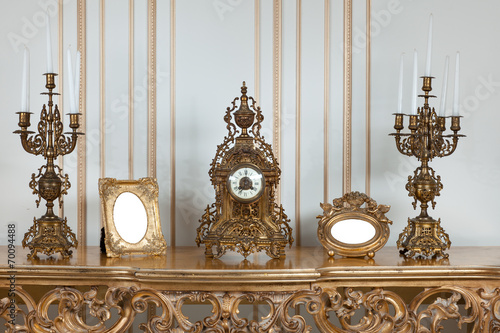 Antique clock with candlesticks. photo