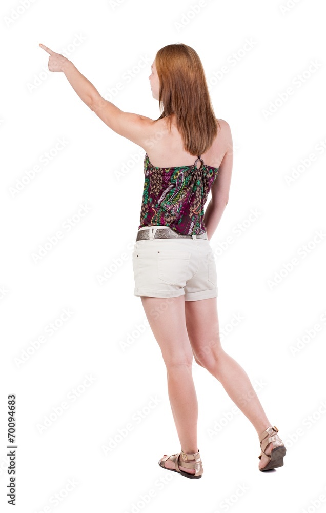 Back view of pointing woman. Back view of pointing woman.