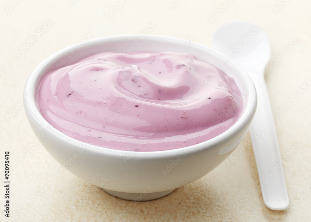 bowl of pink blueberry yogurt bowl of pink blueberry yogurt