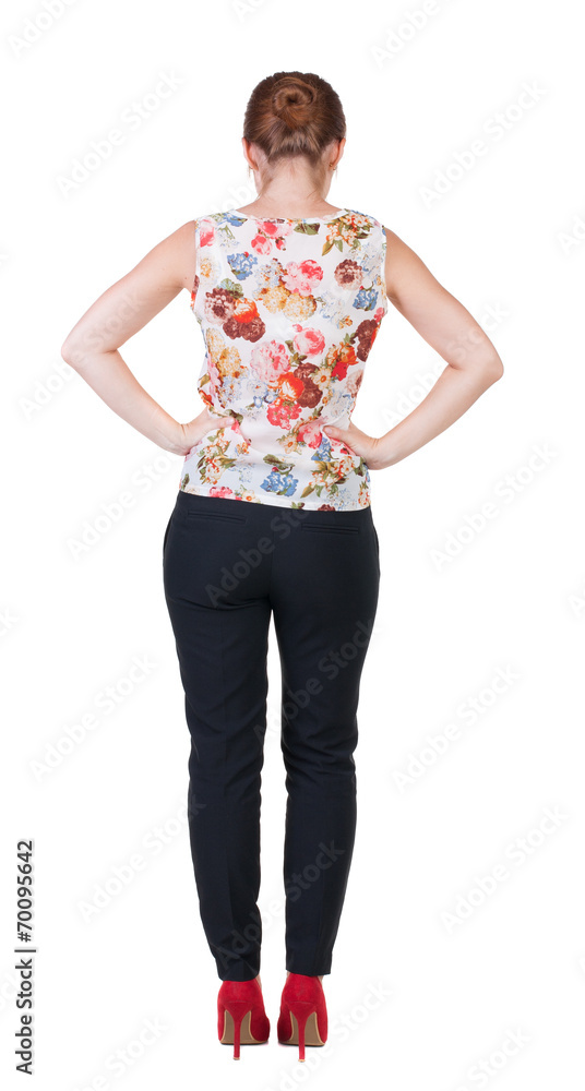 back view of standing young beautiful redhead woman. back view of standing young beautiful redhead woman.