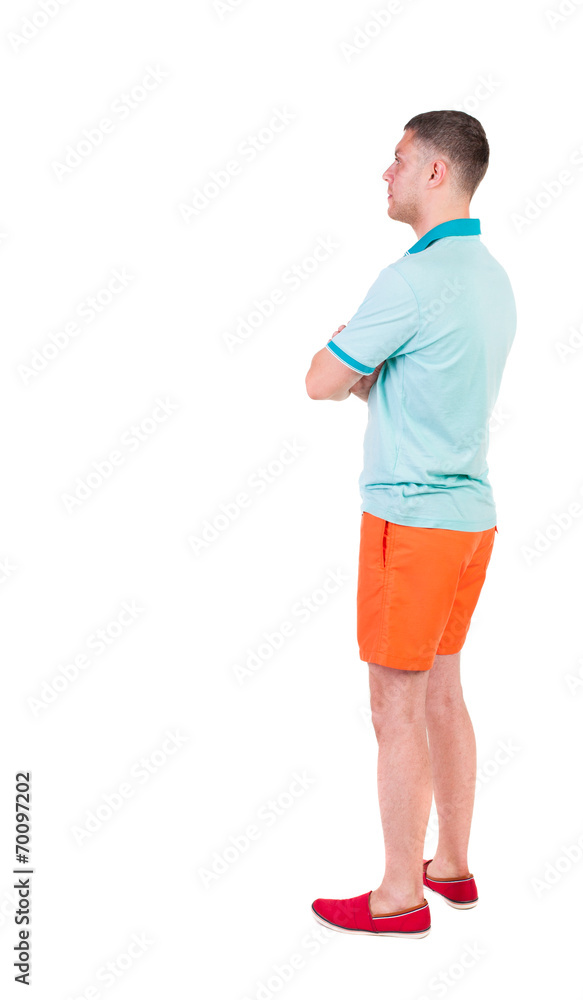 Back view of young manin shorts looking. Back view of young manin shorts looking.
