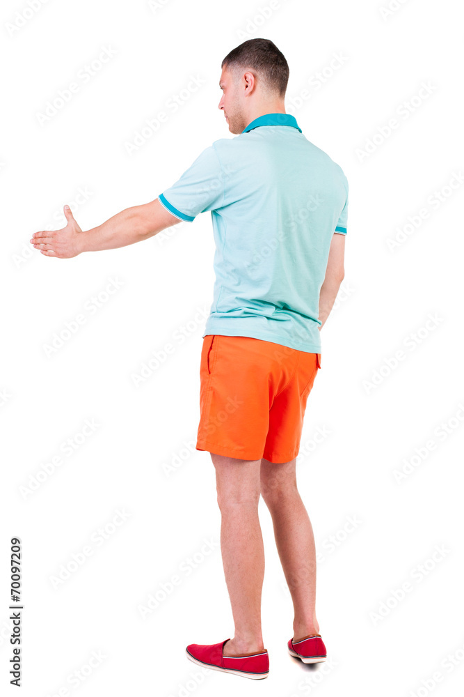 Back side view of man in shorts handshake. Back side view of man in shorts handshake.