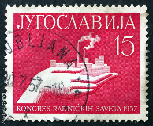 Postage stamp Yugoslavia 1957 Hand Holding Factory