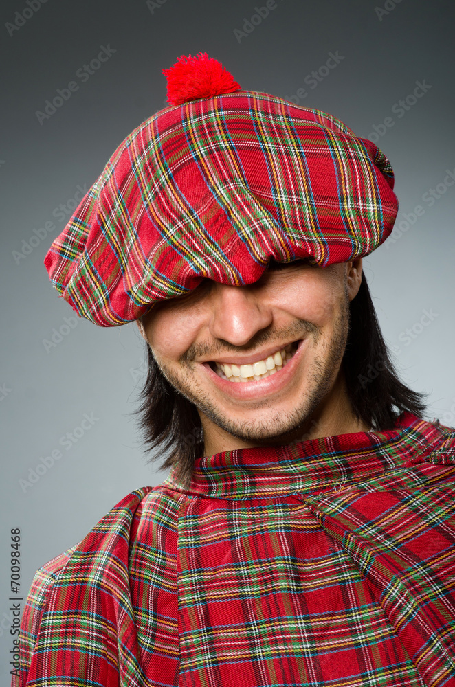 Fototapeta premium Funny scotsman in traditional clothing