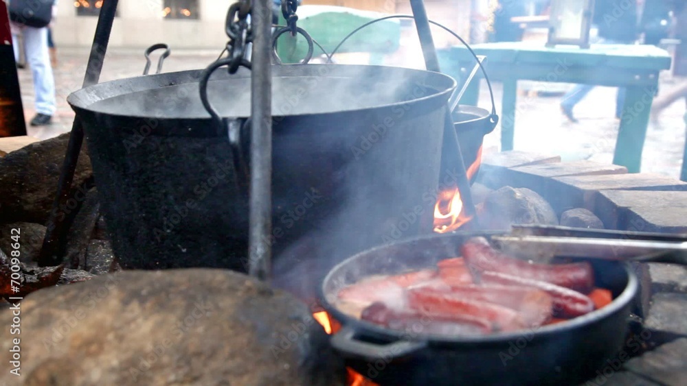 cauldron with the tasty mulled wine cooked over the open fire