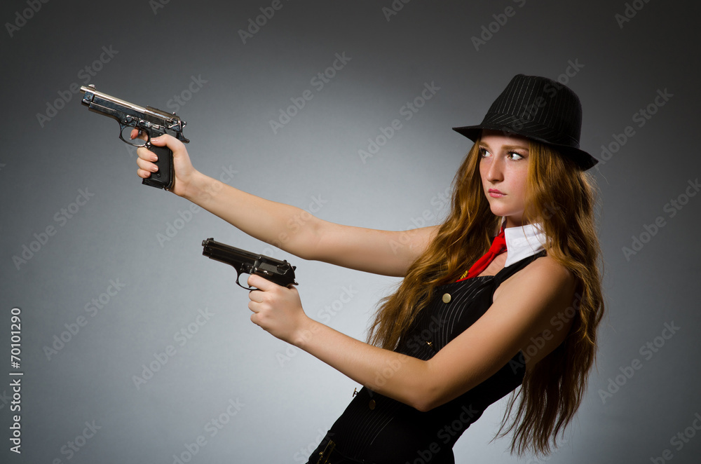 Woman gangster with gun in hand