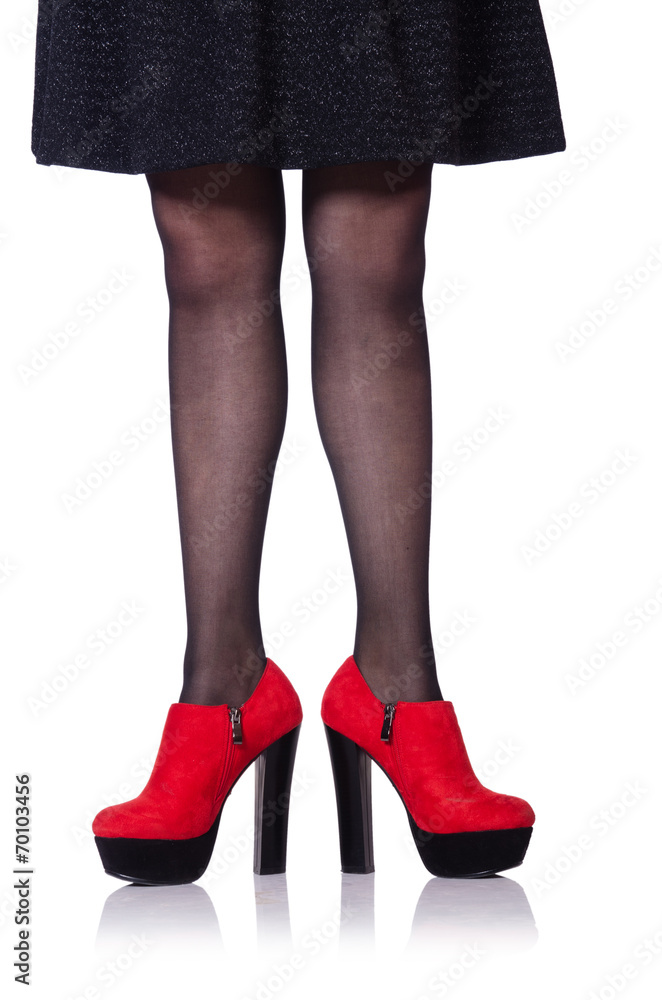 Woman legs with red shoes isolated on the white Woman legs with red shoes isolated on the white