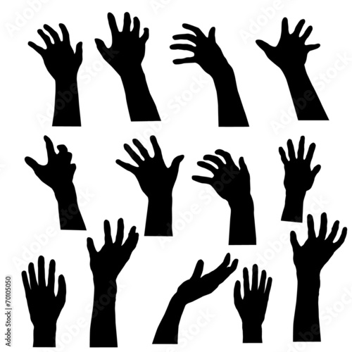 Hand ghosts rising from the grave on Halloween.